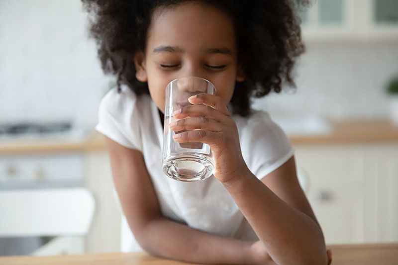 Young Girl Drinking Pure Water From Glass